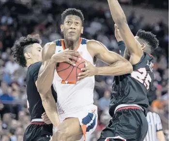  ?? SEAN RAYFORD/ASSOCIATED PRESS FILE ?? Virginia’s De’Andre Hunter, center, fresh off an NCAA championsh­ip, could go to Phoenix as the No. 6 pick.