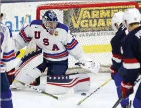  ?? JAY LAPRETE - THE ASSOCIATED PRESS ?? In this Sunday, Dec. 17, 2017 photo, United States’ Joseph Woll makes a save during hockey practice in Columbus, Ohio. Expectatio­ns will be high when the US under-20 team defends its title on home soil at the World Junior tournament, starting the day...