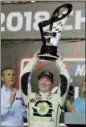  ?? TERRY RENNA — THE AP ?? Tyler Reddick holds the trophy after winning the NASCAR Xfinity Series championsh­ip auto race at the Homestead-Miami Speedway, Saturday in Homestead, Fla.