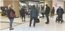  ?? GREG SOUTHAM ?? Shoppers line up at a store in Southgate Centre Mall Friday to take advantage of the last hours of looser retail rules.