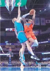  ?? SUE OGROCKI AP ?? Thunder’s Shai Gilgeous-Alexander, who had 40 points, shoots over Suns’ Jock Landale.