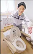  ?? SHIMBUN THE JAPAN NEWS ?? Toshihiko Yoshitomi has succeeded in developing a movable flushing toilet system.
