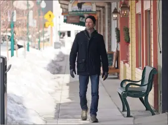  ?? Associated Press ?? Shelby Rognstad, a Democrat who is mayor of Sandpoint, Idaho, walks last month in downtown Sandpoint. Rognstad, who is running for governor, worries about the trend of a growing number of real estate companies advertisin­g to conservati­ves.