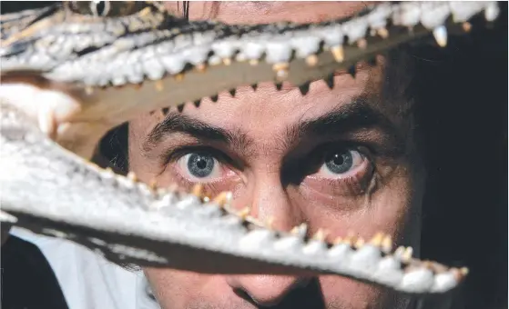  ?? Picture: JAMES CROUCHER ?? Andrew Traucki, whose film Black Water: Abyss is hitting the big time in the UK, with a baby saltwater crocodile at Sydney's Taronga Zoo.