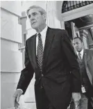  ??  ?? Robert Mueller is also investigat­ing possible obstructio­n in the firing of James Comey. ANDREW HARNIK/AP