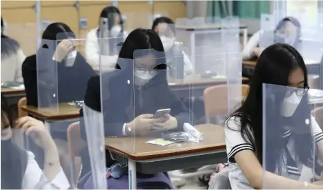  ?? AP ?? Pupils in South Korea returned to school last week but more than 60 schools near Seoul immediatel­y sent children home again after two were found to be infected with the coronaviru­s