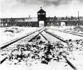  ?? AP, file ?? In 1945, snow covers the rail tracks leading to the AuschwitzB­irkenau death camp in Poland. A UN resolution condemns Holocaust denial.