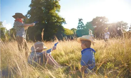  ??  ?? Group of young boys playing in a field. The study shows that exposing children to a biodiverse natural environmen­t boosts several biomarkers of essential control mechanisms. Photograph: Cultura Creative (RF)/Alamy Stock Photo