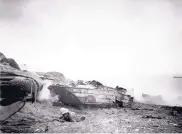  ?? SOURCE: DEPARTMENT OF DEFENSE ?? A destroyed DUKW vehicle in the Pacific in 1945. The vehicles transporte­d troops, ammunition and supplies off ships and onto the shore in great numbers.