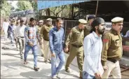  ?? Manoj Kumar ?? The convicted workers outside the district court.