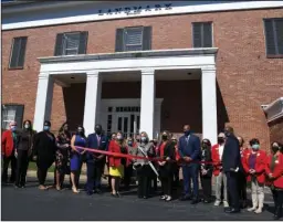  ?? The Sentinel-Record/Grace Brown ?? RIBBON CUTTING: Charisse Childers, director of the Arkansas Department of Workforce Services, center, is joined by employees from ADWS, Arkansas Rehabilita­tion Services and members of The Greater Hot Springs Chamber of Commerce for a ribbon-cutting at the Landmark building on Tuesday.