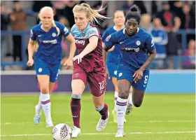  ??  ?? Running clear: Kate Longhurst sets up a West Ham attack against Chelsea