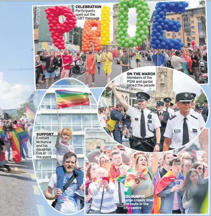  ??  ?? SUPPORT Emmett McKenna and his daughter Eva at the event CELEBRATIO­N Participan­ts spell out the LGBT message ON THE MARCH Members of the PSNI and gardai joined the parade COLOURFUL Large crowds lined the route in the city centre