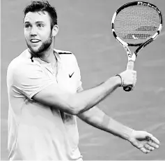  ?? — AFP photo ?? Jack Sock celebrates winning against France’s Julien Benneteau during the semi-final round at the ATP World Tour Masters 1000 indoor tennis tournament in Paris in this Nov 4 file photo.