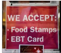  ?? SCOTT HEINS — GETTY IMAGES ?? A sign alerting customers about SNAP food stamps benefits is displayed at a Brooklyn grocery store on Dec. 5, 2019, in New York City.