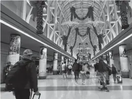  ?? Chicago Tribune/tns ?? In this file photo, Thanksgivi­ng travelers walk through Terminal 3 on Nov. 25 at O’hare Internatio­nal Airport.