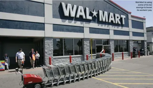  ??  ?? Wal-Mart is using
some of its tax savings to boost its workers’ pay.