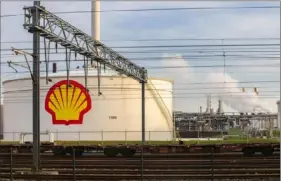  ?? Peter Boer/Bloomberg ?? The Shell Pernis refinery in Rotterdam, Netherland­s. Shell pledged to reduce its greenhouse gas emissions by 20% within a decade and to net-zero before 2050. But a Dutch court said that is not enough.