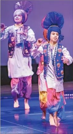  ?? The Canadian Press ?? Nine-year-old Viaan Deol (right), has been taking bhangra lessons since he was four. A small pilot project at four elementary schools in Surrey, where students took lessons in the Punjabi folk dance for seven months suggests it improved their aerobic fitness levels.