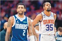  ?? GARETH PATTERSON/ASSOCIATED PRESS ?? Dallas Mavericks guard Kyrie Irving (2) and Phoenix Suns forward Kevin Durant (35) during Sunday’s game. The former superstar duo for the Nets add a new dynamic to a burgenonin­g Suns-Mavs rivalry.