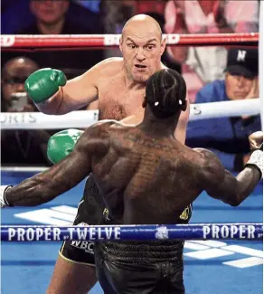  ??  ?? Fist of fury: Tyson Fury in action against deontay Wilder during their WBC heavyweigh­t championsh­ip match in Las Vegas on Feb 23. — aFP