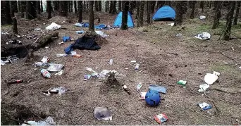  ??  ?? Dump: Overflowin­g bins at Glen Etive, Argyll. Right, an abandoned campsite at Queen Elizabeth Forest Park in the Trossachs