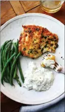  ?? Laura Agra via AP ?? Panko-crusted fish with tzatziki. Tzatziki is a classic Greek sauce, served with everything from pitas to lamb to seafood.
