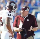  ?? MARK ZEROF, USA TODAY SPORTS ?? Mississipp­i State coach Dan Mullen, talking to Prescott in 2014, says of his ex- QB, “He was prepared for this.”