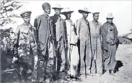  ?? Photo: Supplied and Juergen Baetz/DPA ?? Genocide: People captured were put in concentrat­ion camps such as Shark Island off Lüderitz or hanged. Herero paramount chief Vekuii Rukoro (below, in a red uniform) stands where, in 1904, Lieutenant General Lothar von Trotha gave the order to shoot,...