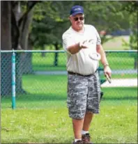  ?? SUBMITTED PHOTO — DENNIS KRUMANOCKE­R ?? Tom Sterner tries for a ringer in Kutztown Day’s quoit tournament.