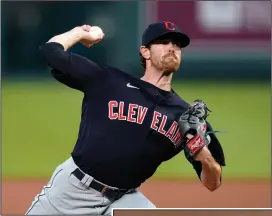  ?? AP PHOTO CHARLIE RIEDEL, FILE ?? In this Aug. 31, 2020, file photo, Cleveland Indians starting pitcher Shane Bieber throws during the first inning of the team’s baseball game against the Kansas City Royals in Kansas City, Mo. Bieber won the AL Cy Young Award on Wednesday night.