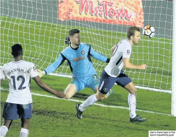  ??  ?? Harry Kane taps in the Spurs equalising goal