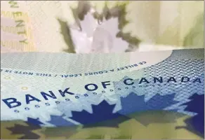  ?? CP PHOTO ADRIAN WYLD ?? The Bank of Canada is once again raising its benchmark interest rate as it sees the economy’s powerful performanc­e pointing to broader, more self-sustaining growth.