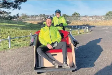  ?? ?? ENJOY THE RIDE: Two of the volunteers for the new CWAS trishaw service in Monifieth.