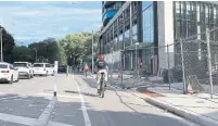  ?? JACK LAKEY ?? For months, the cycling lane on the south side of Bloor Street was closed to apply the finishing touches on a new building. It was reopened after an Aug. 13 Fixer column about the problem.