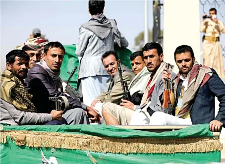  ?? Reuters/File ?? Houthi militants ride on the back of a truck after participat­ing in a funeral of a fighter killed in clashes against govt forces in Yemen’s oil-rich province of Marib.