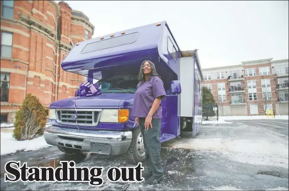  ?? (Detroit Free Press/Antranik Tavitian) ?? Brandy Ali poses for a portrait in front of her newly opened Spa Land mobile spa in Detroit. The camper was converted to bring her spa services to her customers, rather than have them come to her.