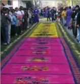  ?? GIOVANNA DELL’ORTO VIA AP ?? This photo shows a blocklong, intricatel­y designed carpet made of colored sawdust on a cobbleston­e street in Antigua, Guatemala. Many people in the Central American city spend as many as 12 hours creating carpets of sawdust and flowers to cover the...