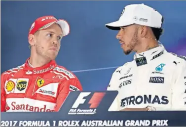  ??  ?? RIVALES. Vettel y Hamilton partían segundo y primero, respectiva­mente, hoy en el GP de Australia.