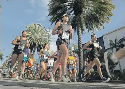  ?? COMPETITOR­S Patrick T. Fallon For The Times ?? in the 2020 Los Angeles Marathon. While running, it’s impossible to pinch your eyes in skepticism.