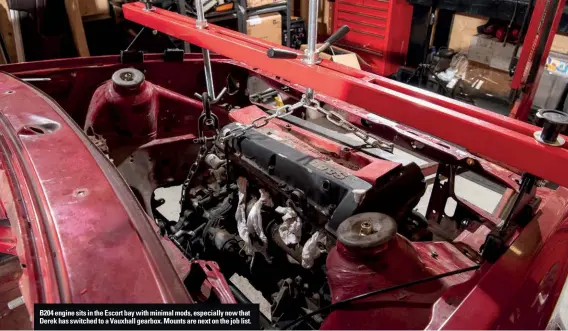  ??  ?? B204 engine sits in the Escort bay with minimal mods, especially now that Derek has switched to a Vauxhall gearbox. Mounts are next on the job list.