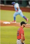  ?? Smiley N. Pool / Dallas Morning News ?? The Astros’ Chase De Jong reacts after giving up a three-run homer to the Rangers’ Rougned Odor.