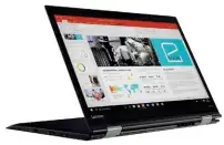  ??  ?? Lenovo X1 Yoga: Das Display lässt sich komplett umklappen. Die Tastatur wird im Tablet-Modus eingefahre­n.