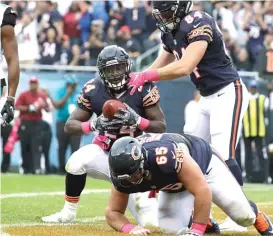  ?? | JEFF ROBERSON/ AP ?? Rookie running back Jordan Howard celebrates his one- yard touchdown run in the second quarter— abright spot in an otherwise lackluster day for him.