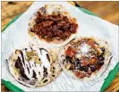  ?? CONTRIBUTE­D BY HENRI HOLLIS ?? Tacos from Supremo include (clockwise from top) al pastor, black bean and mole poblano.