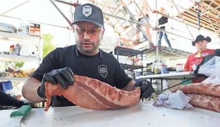  ?? JOE RONDONE/THE COMMERCIAL APPEAL ?? Get ready for a whole lotta BBQ in May as Memphis hosts two barbecue competitio­ns.