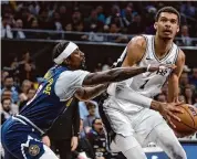  ?? Sam Owens/Staff photograph­er ?? Though the Spurs are on track for their worst year in franchise history, Victor Wembanyama has rarely shied away from a postgame interview request.