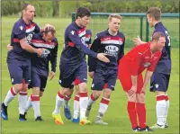  ??  ?? Saints skipper Ross Maitland is congratula­ted by his teammates after opening the scoring against Shawlands in the first minute.