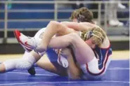  ?? STAFF PHOTO BY OLIVIA ROSS ?? Chattanoog­a Christian School’s Ryder Smith (left) goes up against Heritage’s Evan Wingrove on Dec. 9 at the McCallie Wrestling invitation­al.