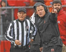  ?? VINCENT CARCHIETTA/USA TODAY SPORTS ?? Rutgers coach Greg Schiano talks with an official during the first half against Michigan State on Oct. 14, 2023, at SHI Stadium.